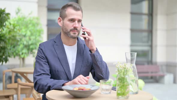 Successful Man Celebrating on Smartphone Front Pose