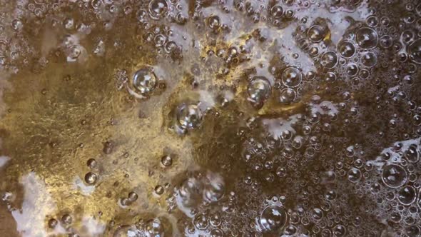 Boiling sugar surface with bubbles
