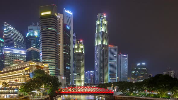 A View of Singapore Business District Skyscrapers in the Night Time with Water Reflections Timelapse