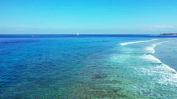 Aerial drone sky of luxury shore beach lifestyle by blue water with white sandy background of a dayo