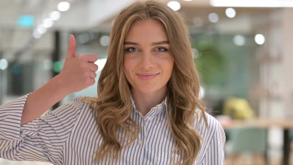 Portrait of Positive Businesswoman Doing Thumbs Up