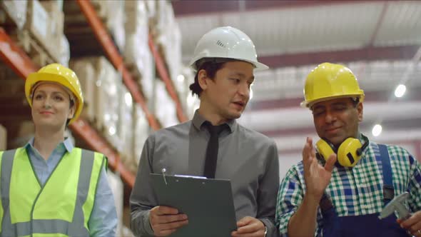 Chef Engineer Walking with Two Employees