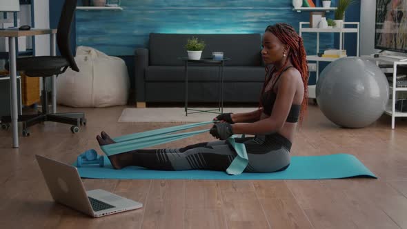 Athetic Black Woman in Sportswear Watching Aerobic Online Sport Workout
