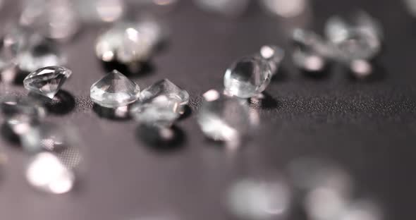 Scattering of Precious Transparent Stones on Black Background  Movie