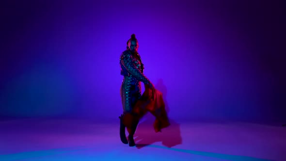 Torero in Blue and Gold Suit or Typical Spanish Bullfighter Isolated Over on a Blue Background.