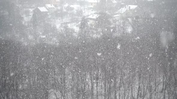 Falling upwards snowflakes during winter snowfall. Abstraction. Slow motion. alt