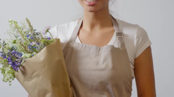 Smiling Florist Posing with Wildflower Bouquet