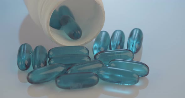 Prescription drugs - Capsules, pills, tablets on reflective background