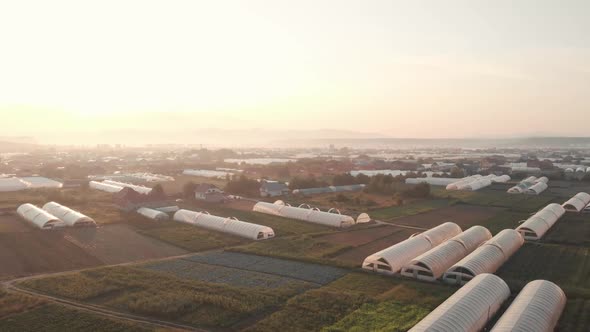 Aerial View of Agricultural Field with Greenhouses