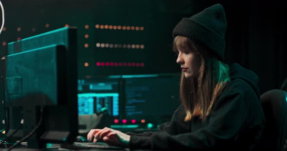 Nonconformist Teenage Hacker Girl Using Computer for Attacking Corporate Servers with Malware