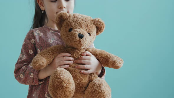 Cute Girl with Plush Bear