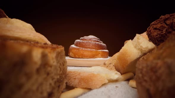 Assortment of Fresh Bread and Bakery on Table Zoom in Video