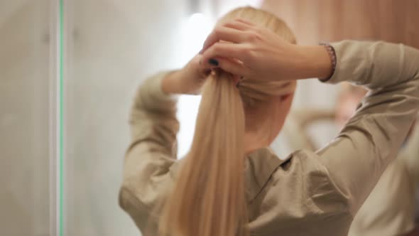 Back view of woman making a tail