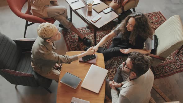 Top-View of Business Colleagues Shaking Hands