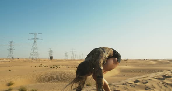 Blonde Lady with Athletic Body is Dancing and Posing in Rub Al Khali Desert