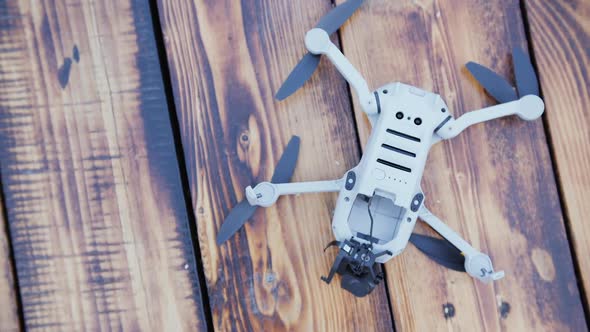 Quadcopter is Damaged After a Collision with the Wooden Terrace