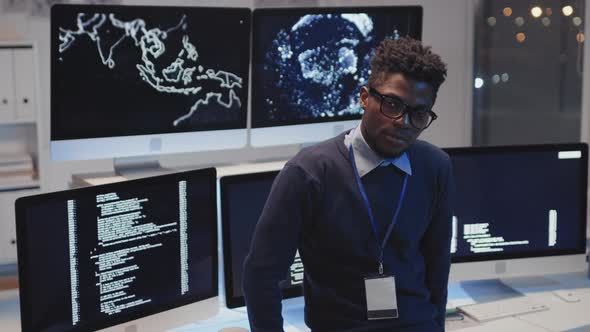 Programmer Posing by Monitors