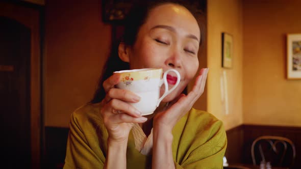 Elegant Japanese woman enjoying a coffee