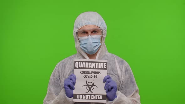 Doctor in Suit Showing Warning Text Slogan on Paper  Quarantine Covid19 Coronavirus Do Not Enter