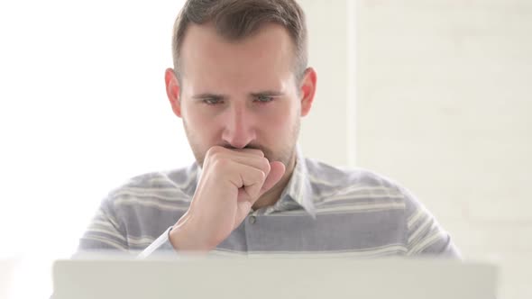 Close Up of Ill Man Coughing at Work