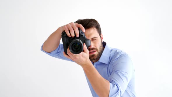 Photographer taking photo with professional digital camera