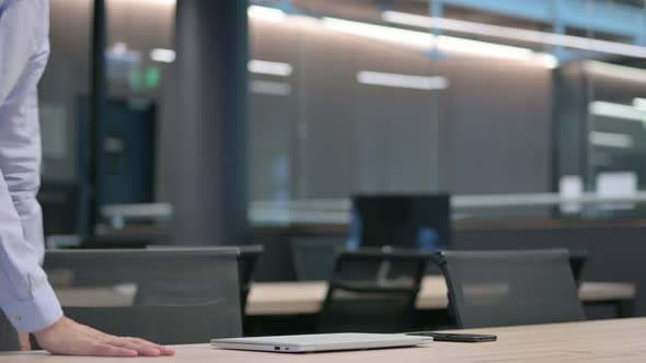 Young Man Coming and Opening Laptop