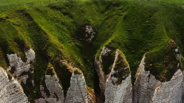 View From Above on the Bizarre Peaks of Sheer Cliffs Overgrown with Grass