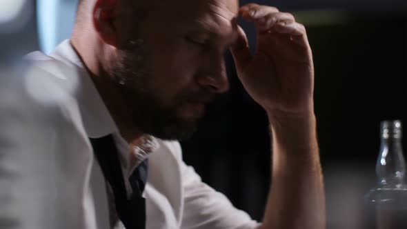 Hopeless Businessman Sipping Glass of Whiskey