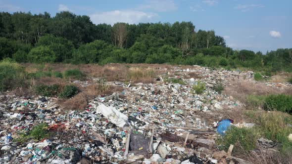 Flying Over A Pile Of Junk And Garbage At A Landfill Site