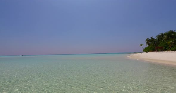 Wide above tourism shot of a sandy white paradise beach and blue sea background 