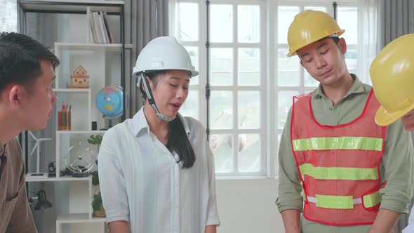 Engineers With Helmets Sharing Ideas About Work, Angry Colleagues Debate Fight Over Paperwork