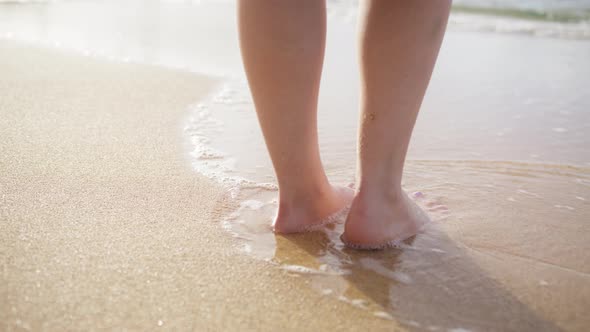 Woman Feet Walking Barefoot on Sandy Beach of Sea Scenic Summer Background