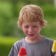 Young Blond Boy Eating Red and Yellow Watermelon on Stick - VideoHive Item for Sale