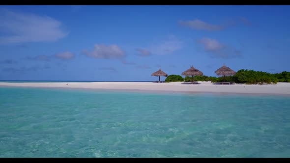 Aerial drone shot travel of tranquil shore beach trip by clear sea and bright sand background of a d