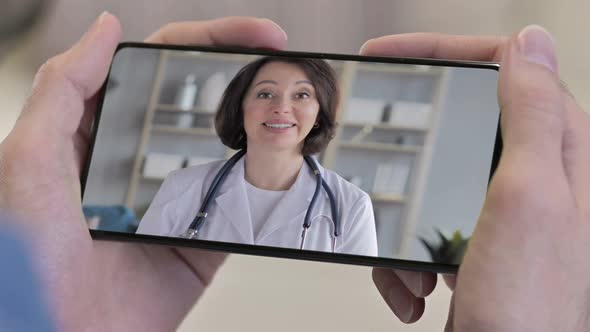 Close Up of Talking Female Doctor in Smartphone Screen Video Chat