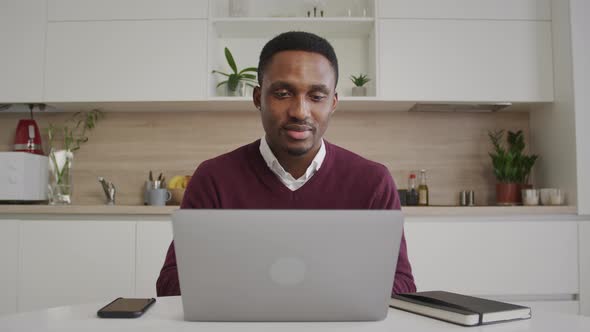 Young African American Student Achieves a Milestone While Studying a Class on a Laptop