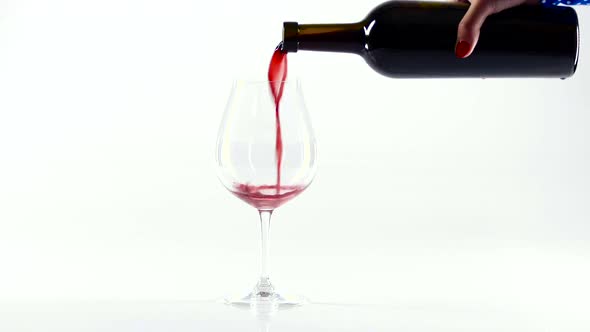 Person Pour Red Wine Into a Glass, White