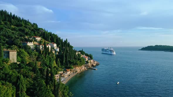 Aerial shot of a cruise ship next to a beach on the Adriatic Sea, Croatia