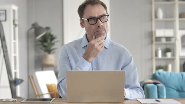 Senior Aged Businessman Thinking at Work