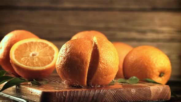 The Orange Falls on the Cutting Board and Splits Into Halves