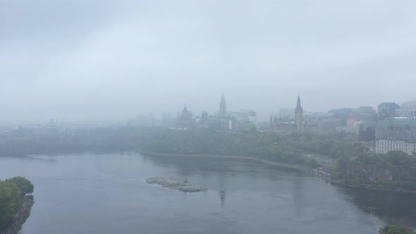 Aerial view of Canadian parliament through thick fog