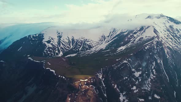 Majestic Birdseye View of Snowy Mountains