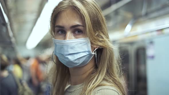 Girl Mask Looking at Camera Carriage Metro Coronavirus. Crowd Passenger Covid-19