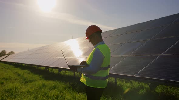 Engineer Working Use Laptop Stand Near Solar Batteries Construction Renewable Power Worker Man