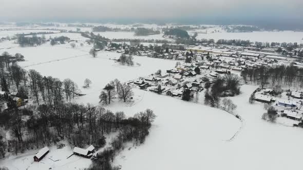 Drone clip of sleepy, snowy village in Sweden.