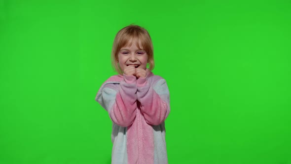 Little Blonde Child Girl Smiling Dancing Celebrating in Unicorn Pajamas Costume on Chroma Key