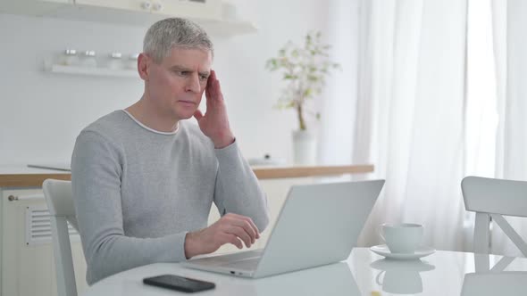 Hardworking Senior Old Man Having Headache at Home