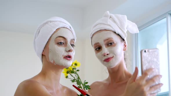 Beautiful Woman Having a Facial Treatment at Spa