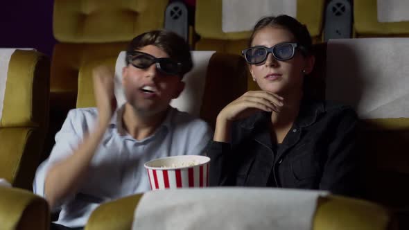 Man and Woman in the Cinema Watching a 3D Movie