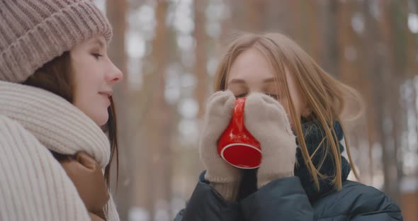 Two lesbians are drinking coffee outdoors LGBT Gay Lesbian Bisexual Transgender Lesbian concept Love